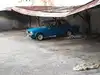 Ein Lada unter einem maroden Wellblech-Carport – gesehen im Kuba-Urlaub. Dem nächsten Karibik-Sturm wird der Unterstand vermutlich nicht standhalten. 